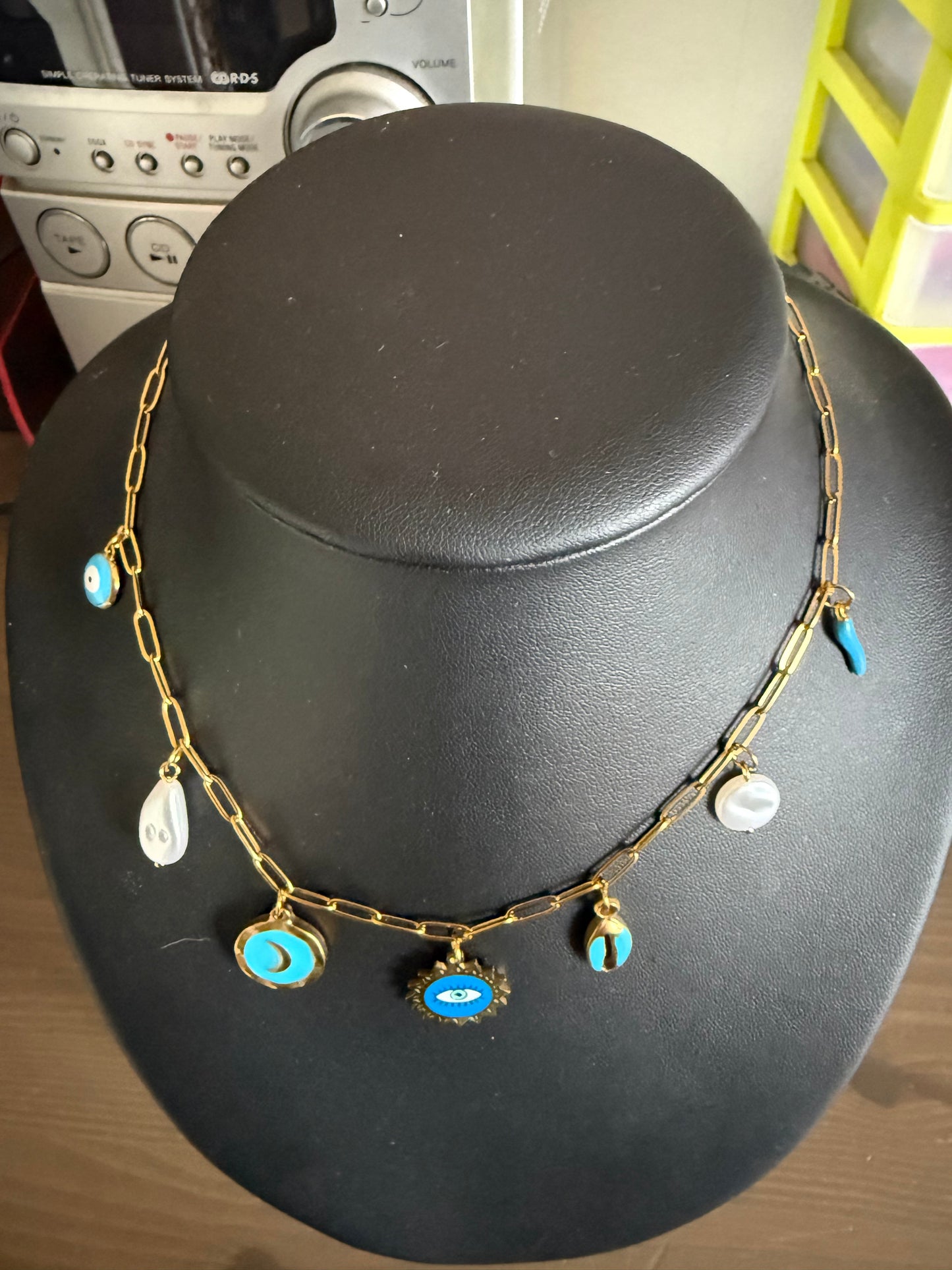 Collier breloques œil