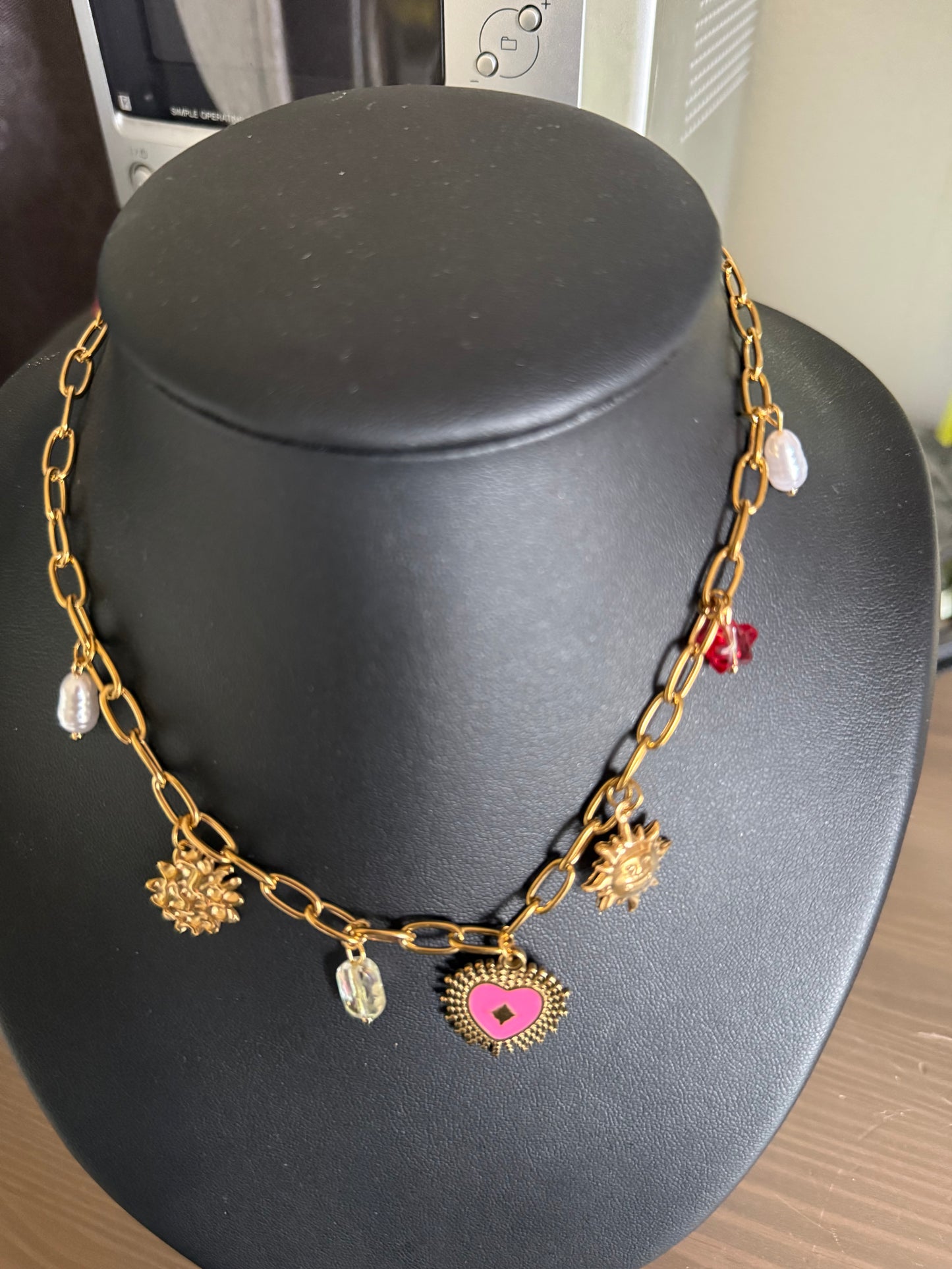 Collier breloques œil